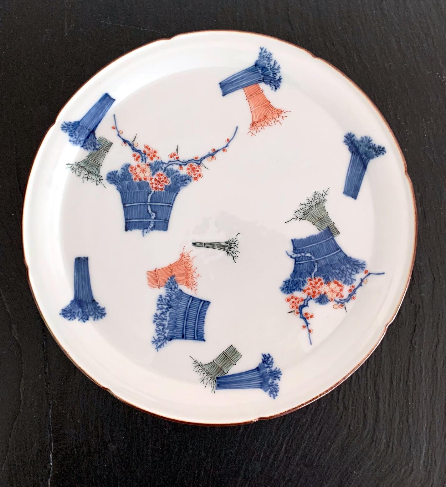 A milky white dish with slight scalloped rim and decorated with cobalt blue iron red and green enamel over glaze, this delicate piece in Kakiemon Style was dated at least to the early 18th century if not earlier, likely made for export market to the
