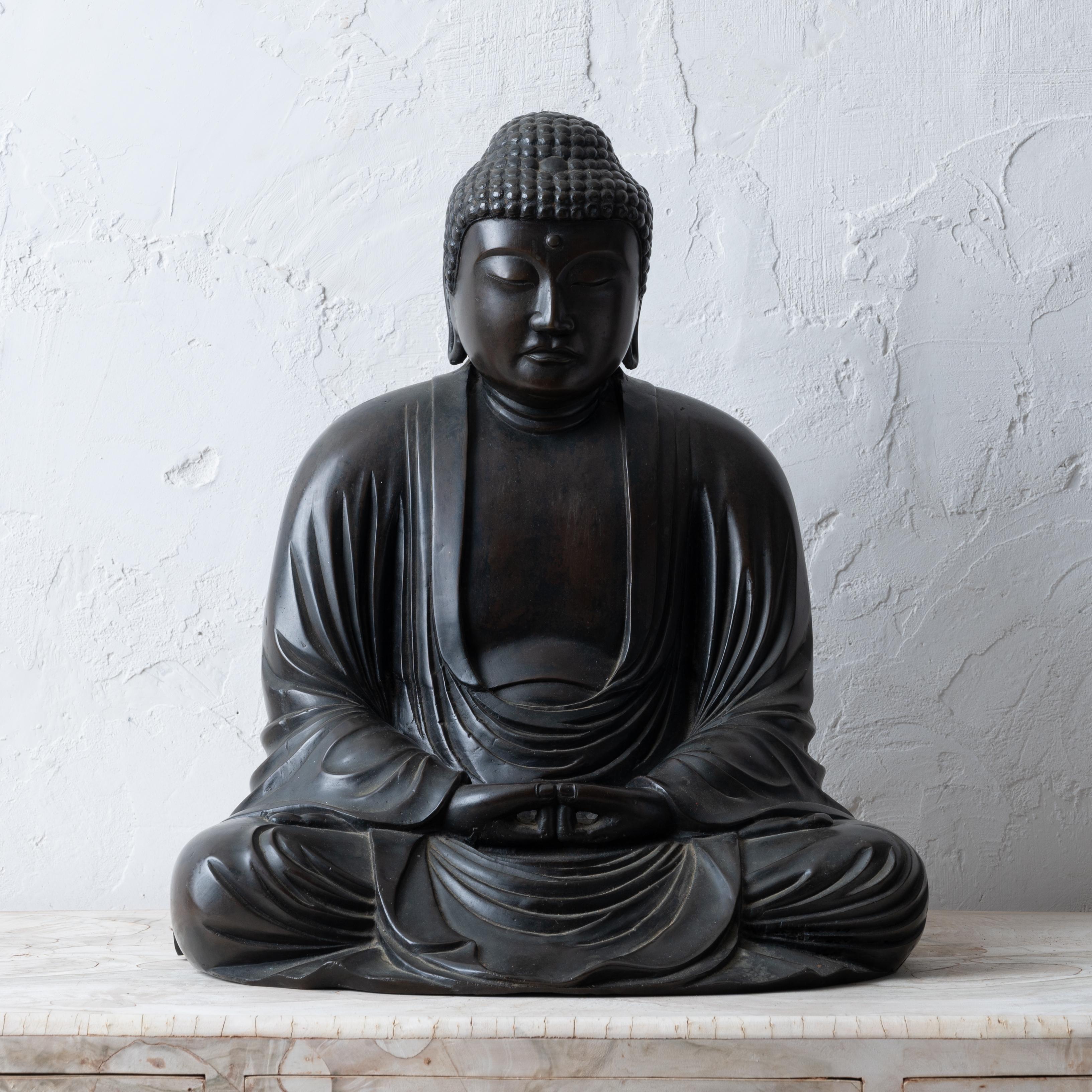 A large Japanese bronze sculpture of seated Buddha, circa 1920s.

16 inches wide by 13 inches deep by 18 inches tall 

