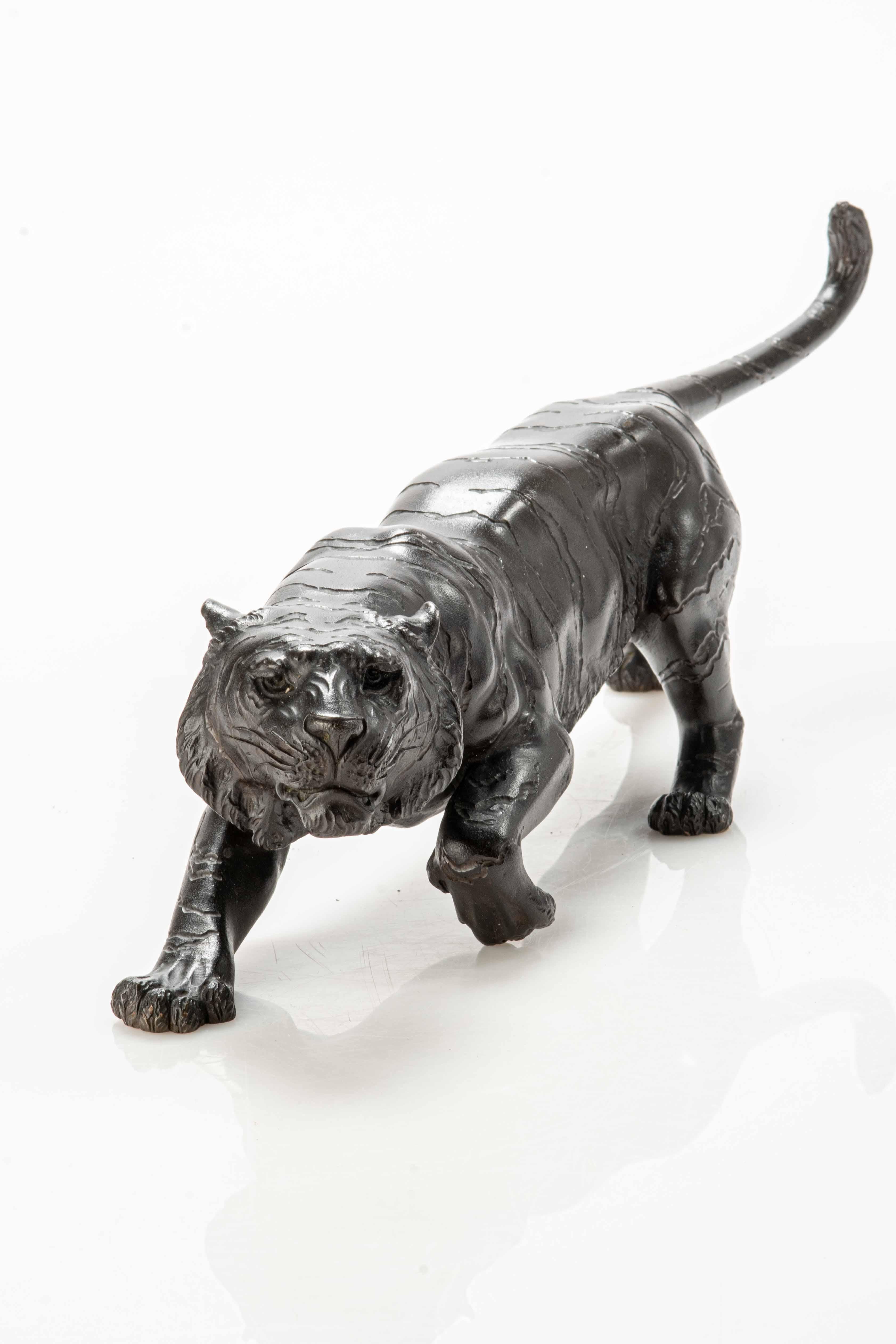 Metalwork A Japanese bronze okimono depicting the study of a tiger For Sale