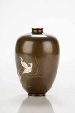 A Japanese bronze vase with three egrets