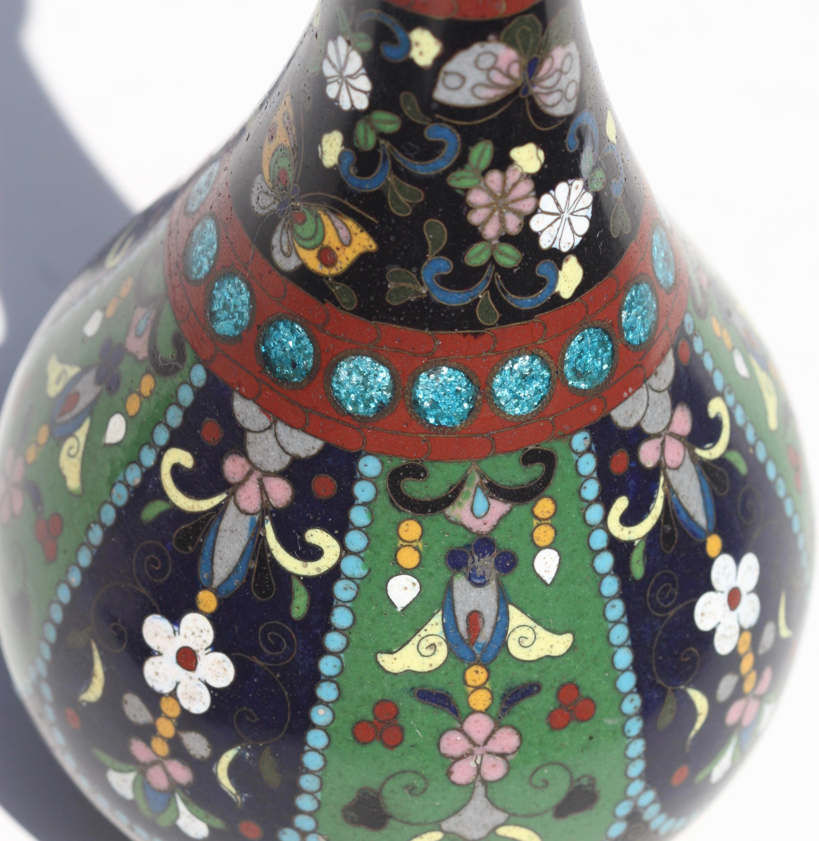 A Japanese Cloisonne enamel vase
19th century
Measures: Height 8.5 in. (21.59 cm.), 
Width 3.62 in. (9.20 cm.).