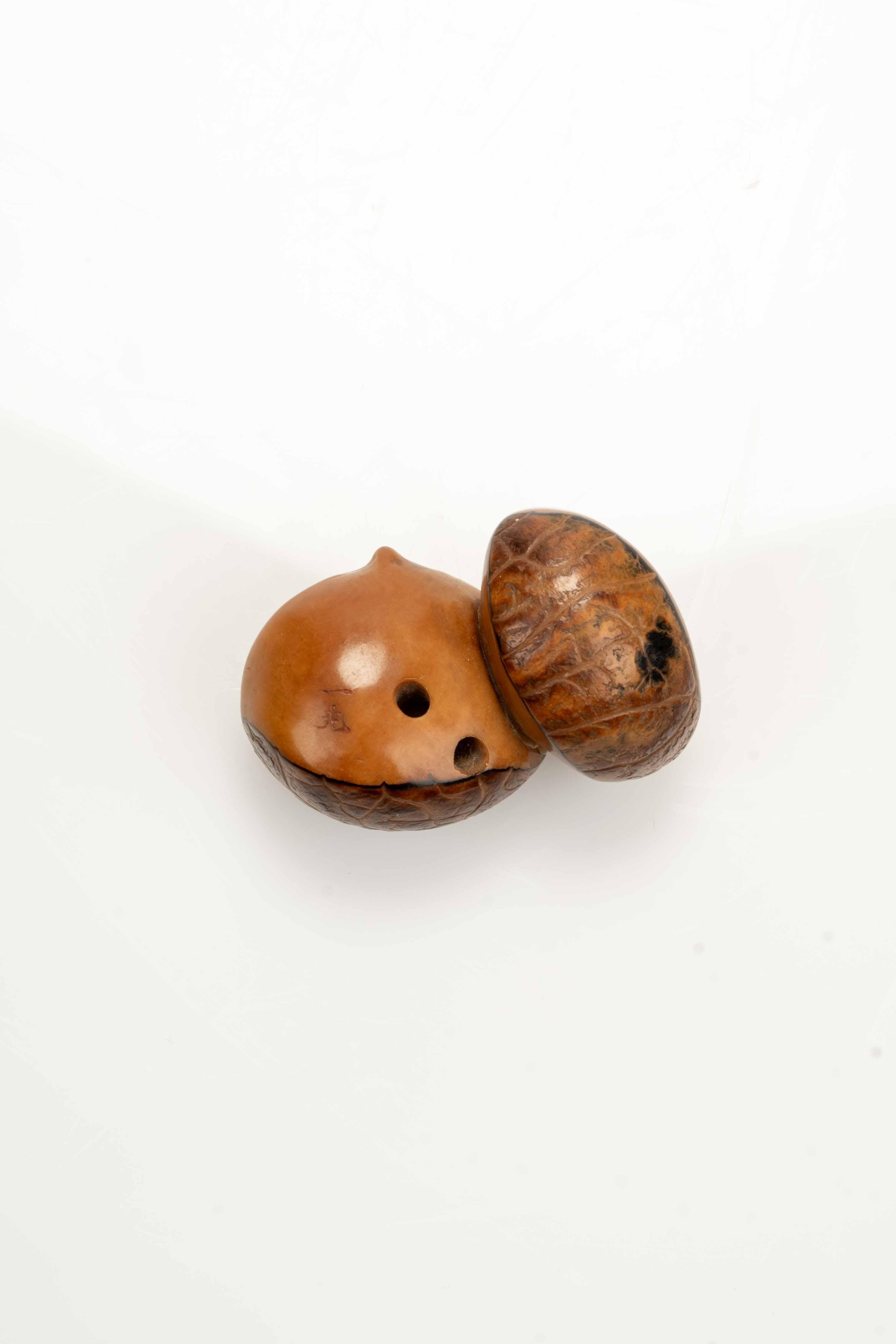 19th Century A Japanese Corozo Nut Netsuke Depicting Two Chestnuts, Signed Ikko en vente