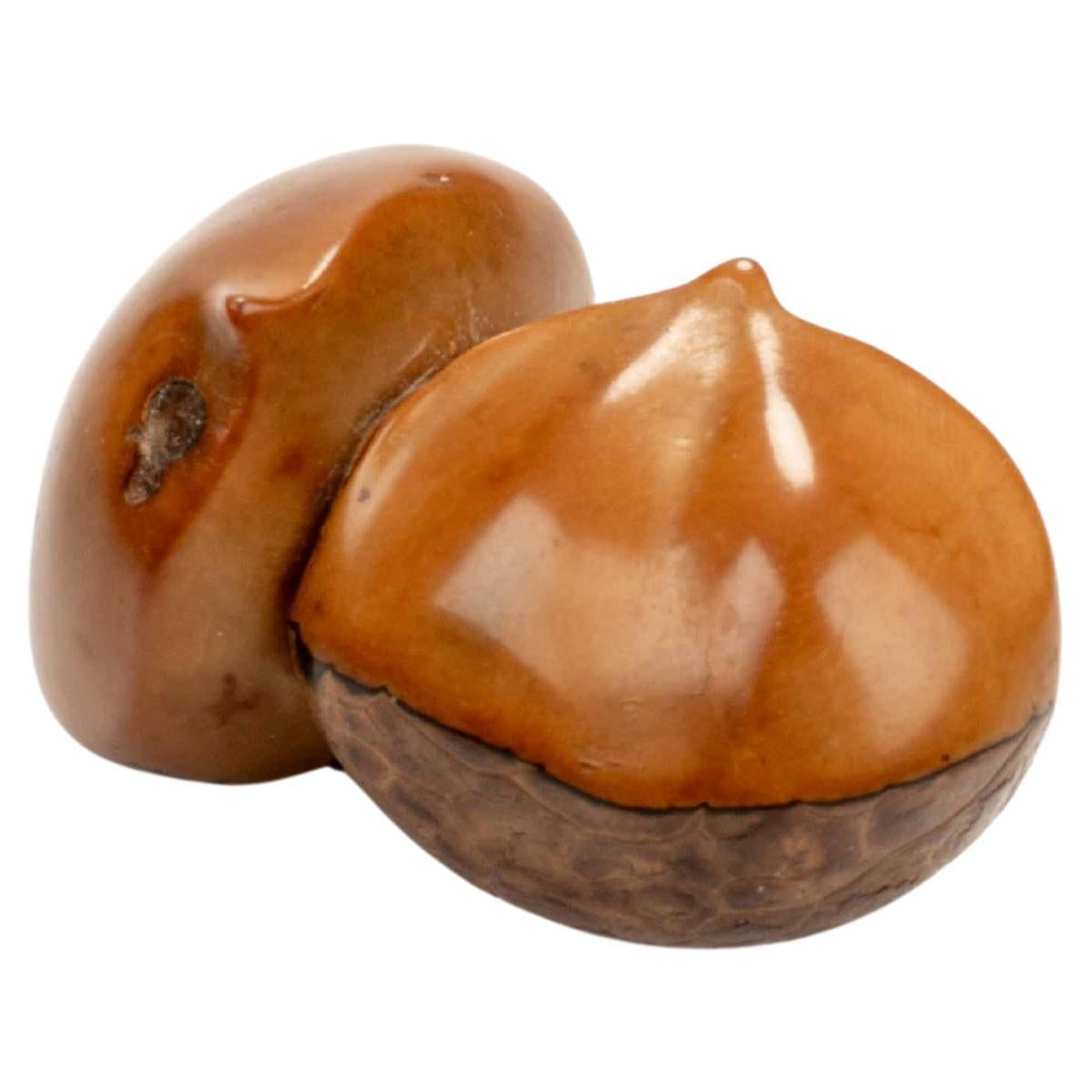 A Japanese Corozo Nut Netsuke Depicting Two Chestnuts, Signed Ikko en vente