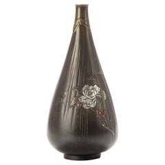 Antique A Japanese drop-shaped bronze vase with peonies