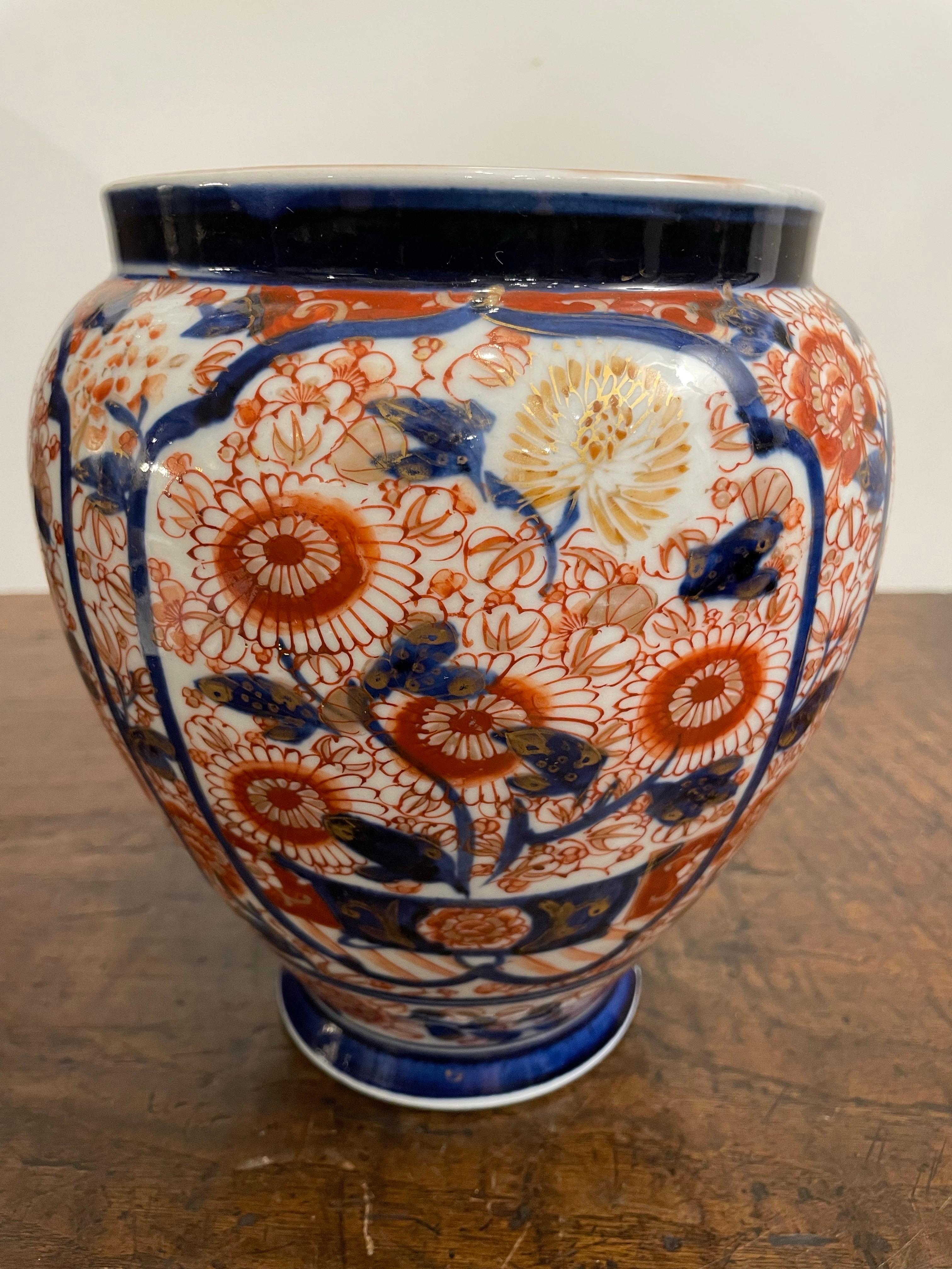 A Japanese Floral Imari Jar, 19th Century

Provenance:  
Private Australian Collection.

Description:
The short neck with a solid blue band, descending to main body comprising four cartouche panels all on a white ground, the whole depicting various