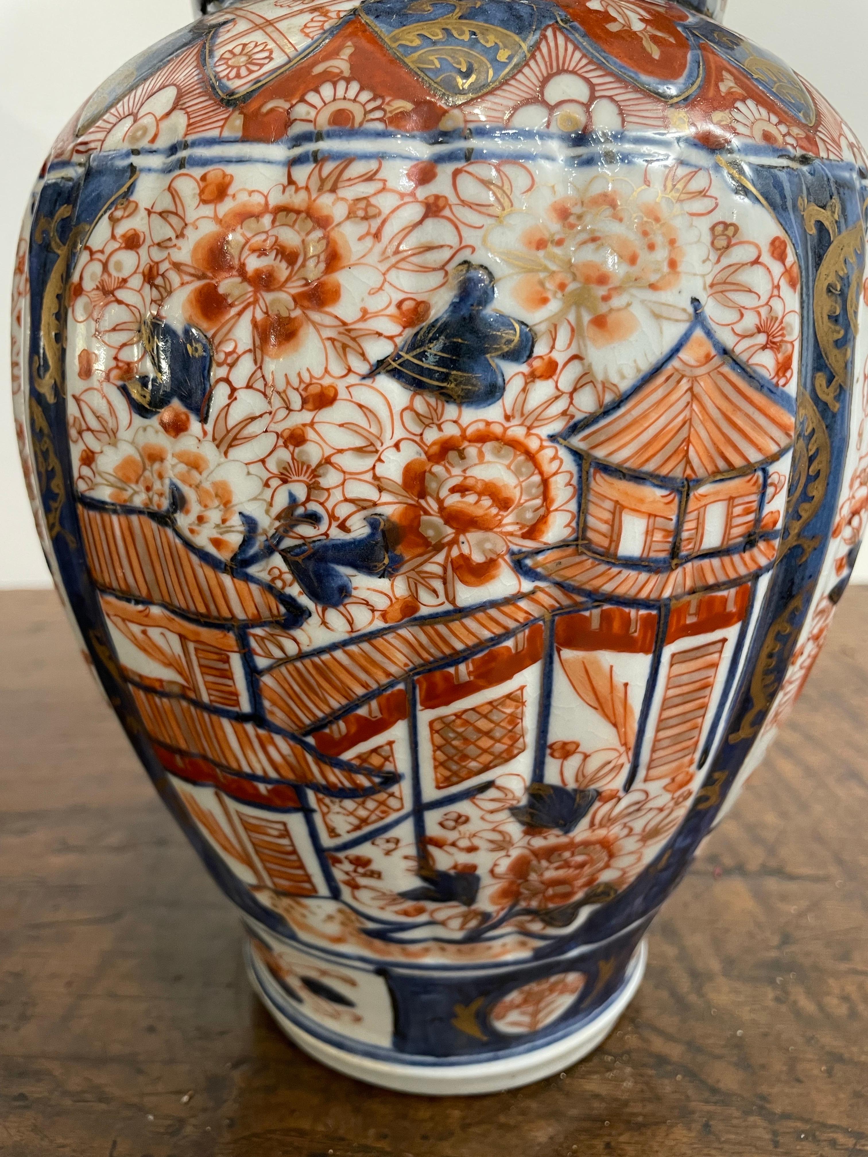 Porcelain A Japanese Fluted and Covered Imari Baluster Vase, 19th Century For Sale