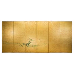 Biombo japonés decorado con una escena naturalista