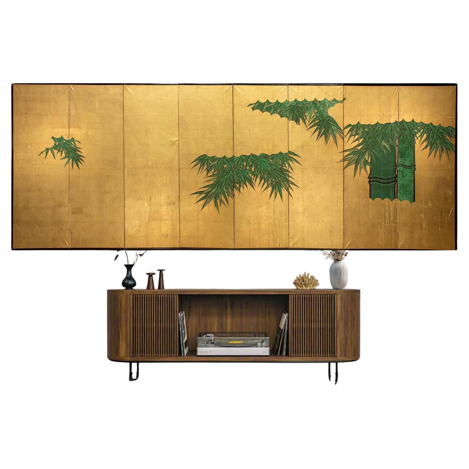A Japanese Folding Screen Decorated With Bamboo Plants On A Gold-leaf