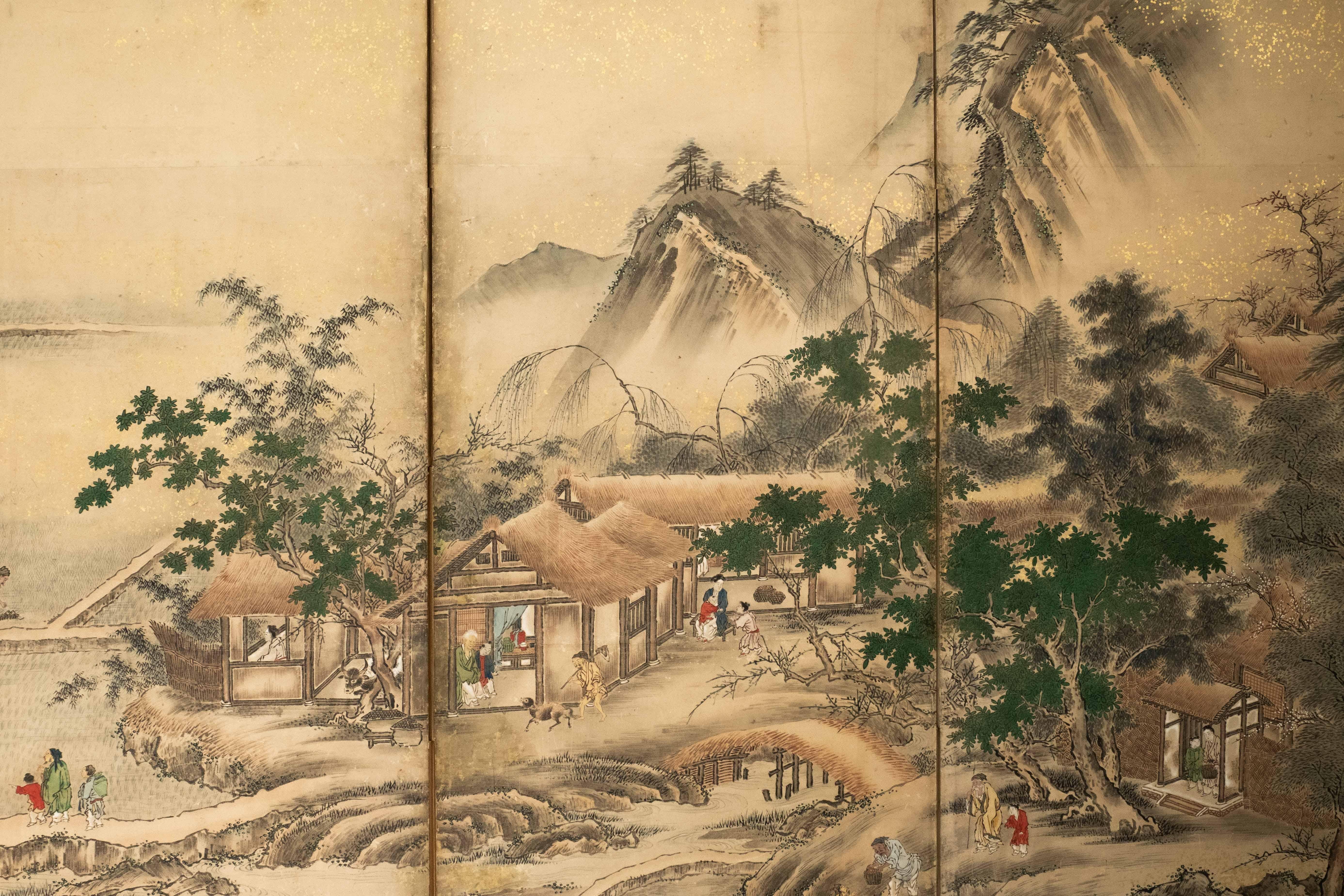 Foglia d’oro A Japanese folding screen depicting an agricultural landscape, signed Eisho Kano in vendita