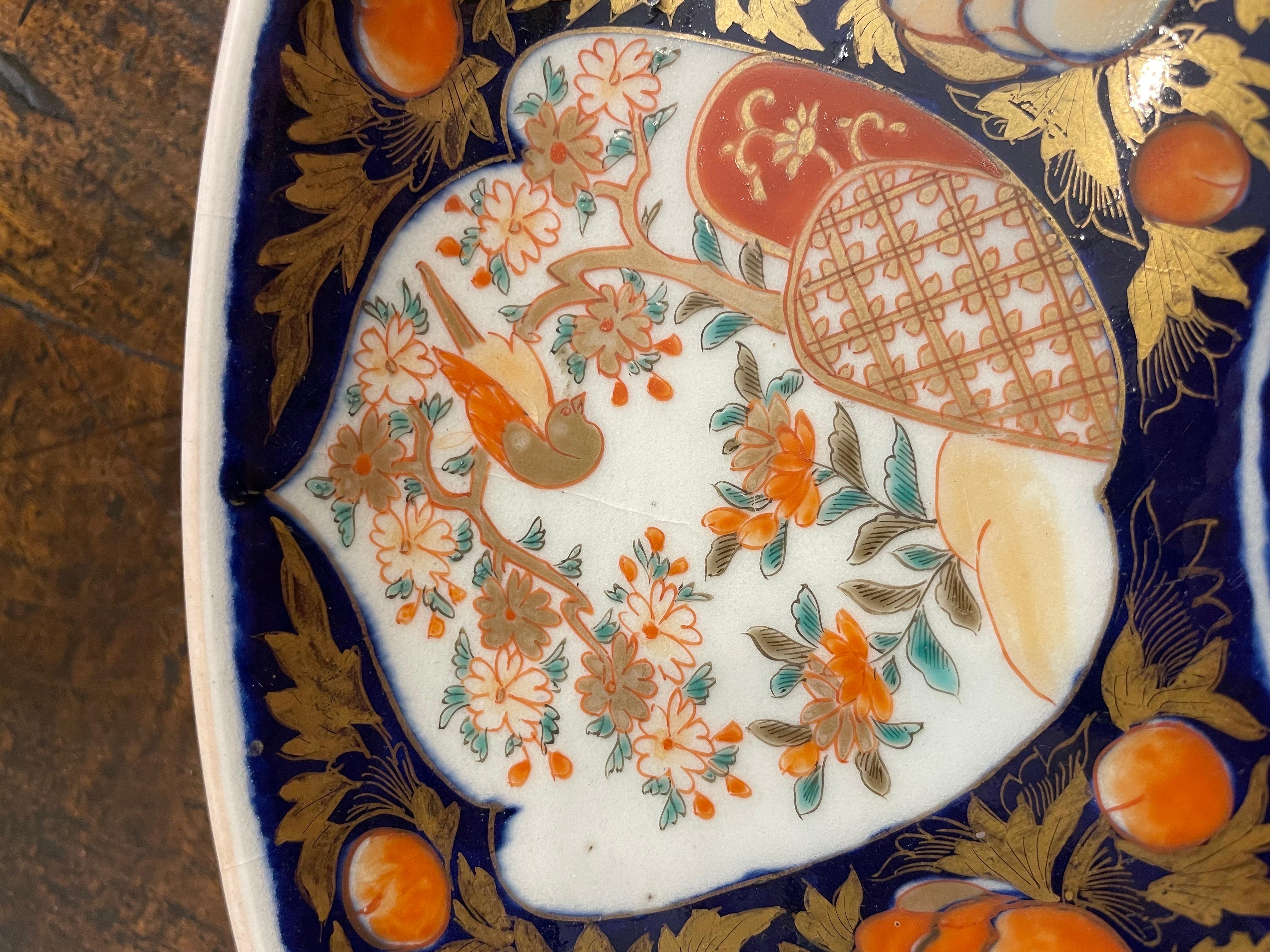 A Japanese Imari Charger, 19th Century

Provenance: Private Australian Collection.

Description:
The central double hou-ou bird in cobalt surrounded by shaped cartouches within a cobalt blue and gilt foliate ground. Home decor, Interior design and