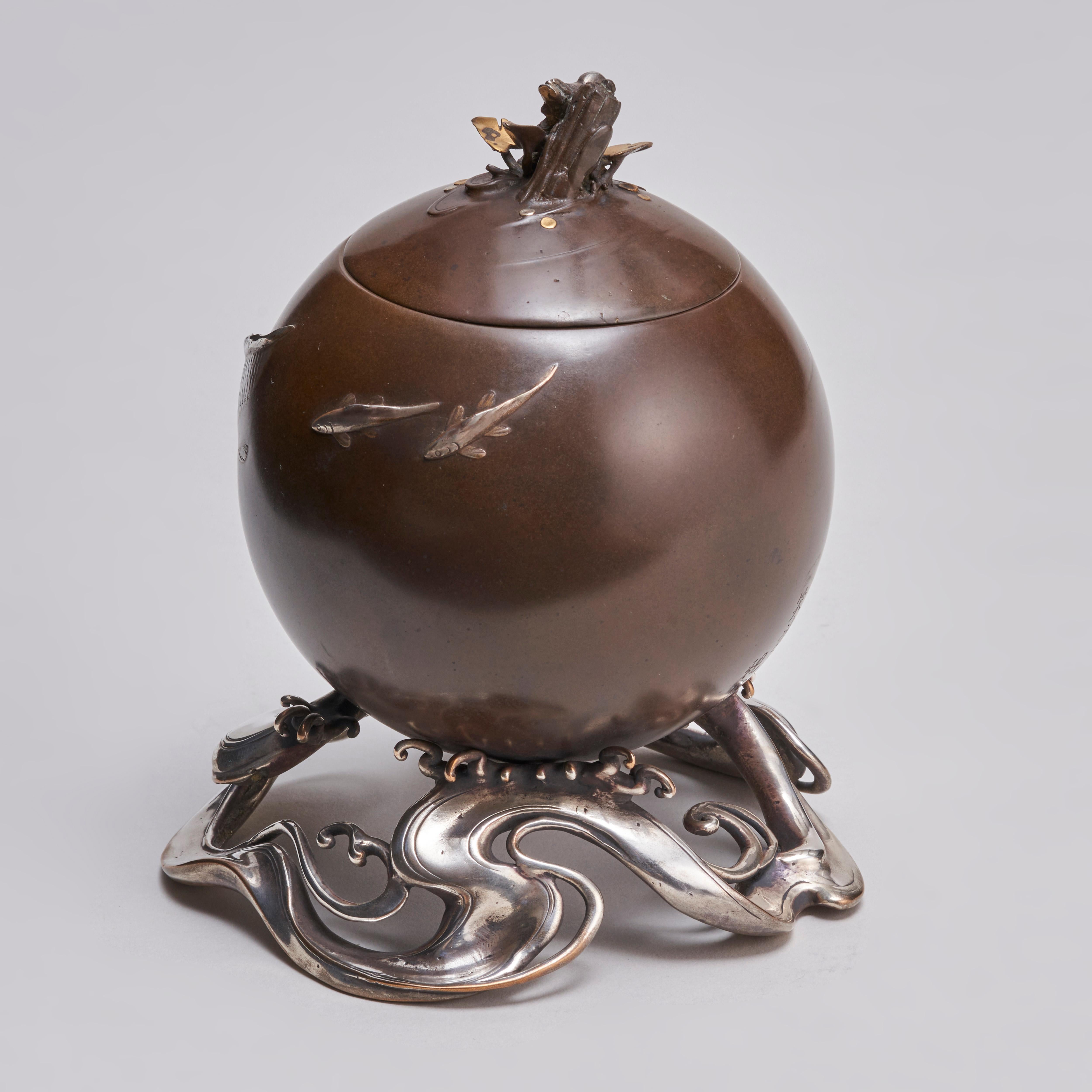 From our collection of Japanese Meiji-era (1868-1912) metalware, this refined Bronze and multi-metal Koro in the form of a Tide Pearl. The Bronze body of the vessel decorated with Silver Carp swimming as if emerging from murky water. The knop of the
