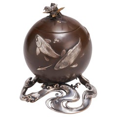 A Japanese, late 19th Century refined Bronze and multi-metal Koro