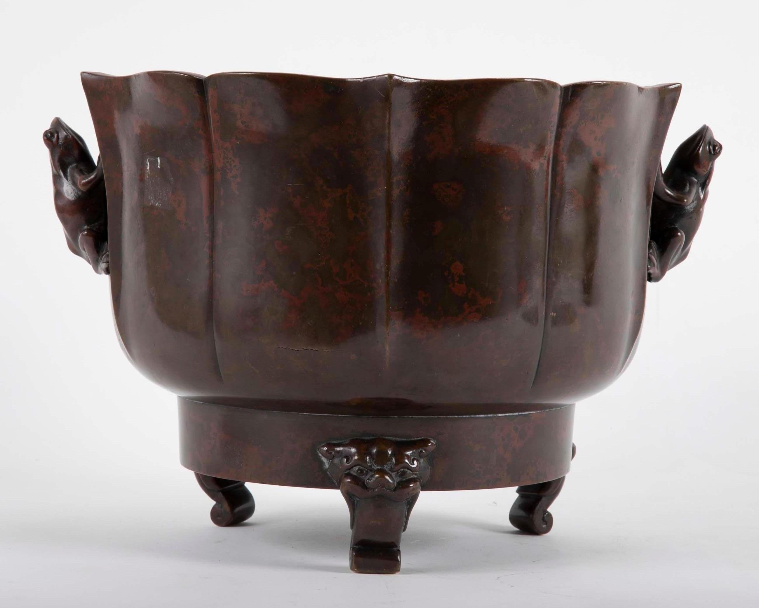 A Japanese Meiji censer rising on three stylized Foo Dogs feet with Frog form handles. Censer having exceptional patination. 
Acquired from Michael Goedhuis, London, 19 June 1987 by repute.