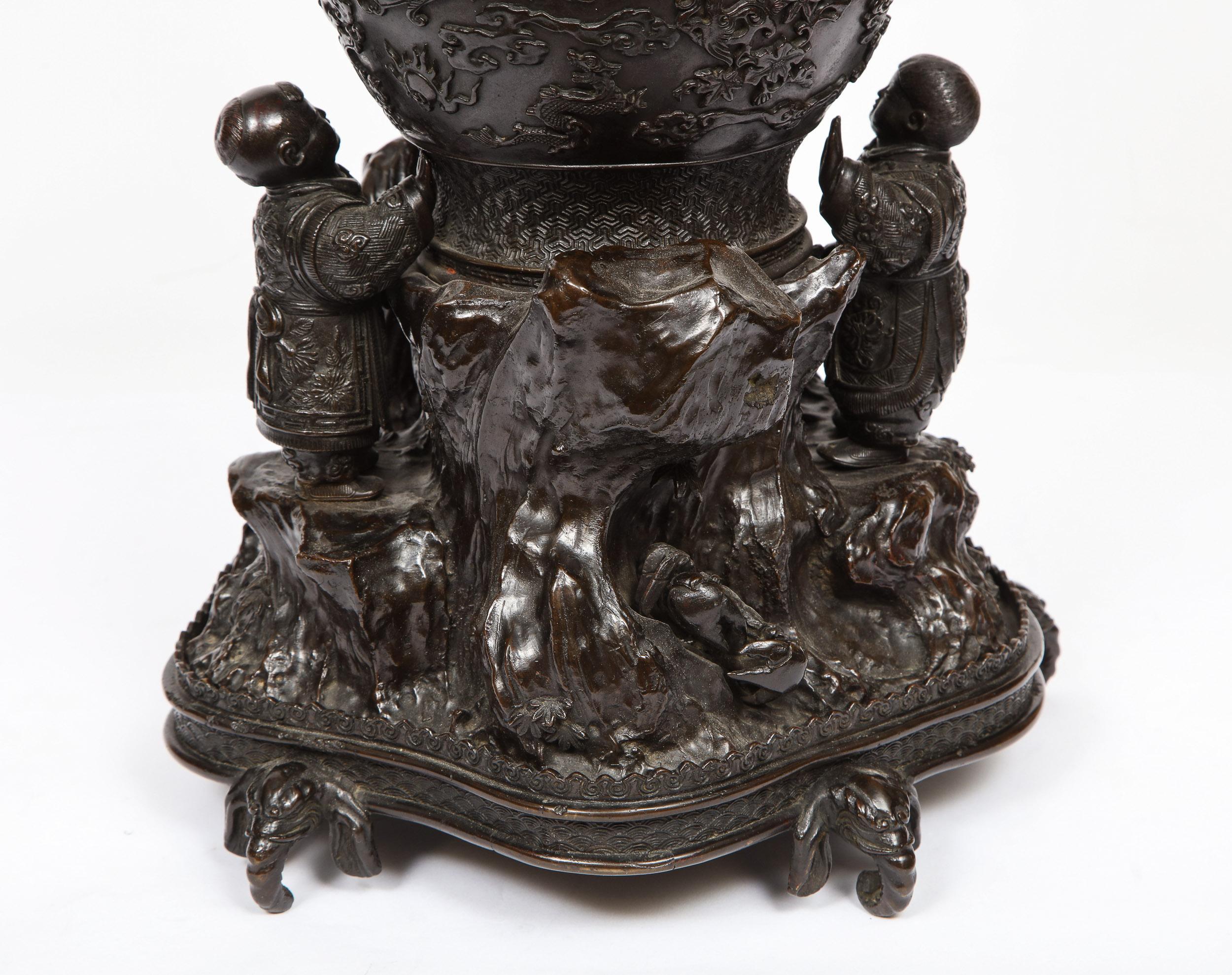 Japanese Patinated Bronze Figural Clock Vase, Meiji Period 10