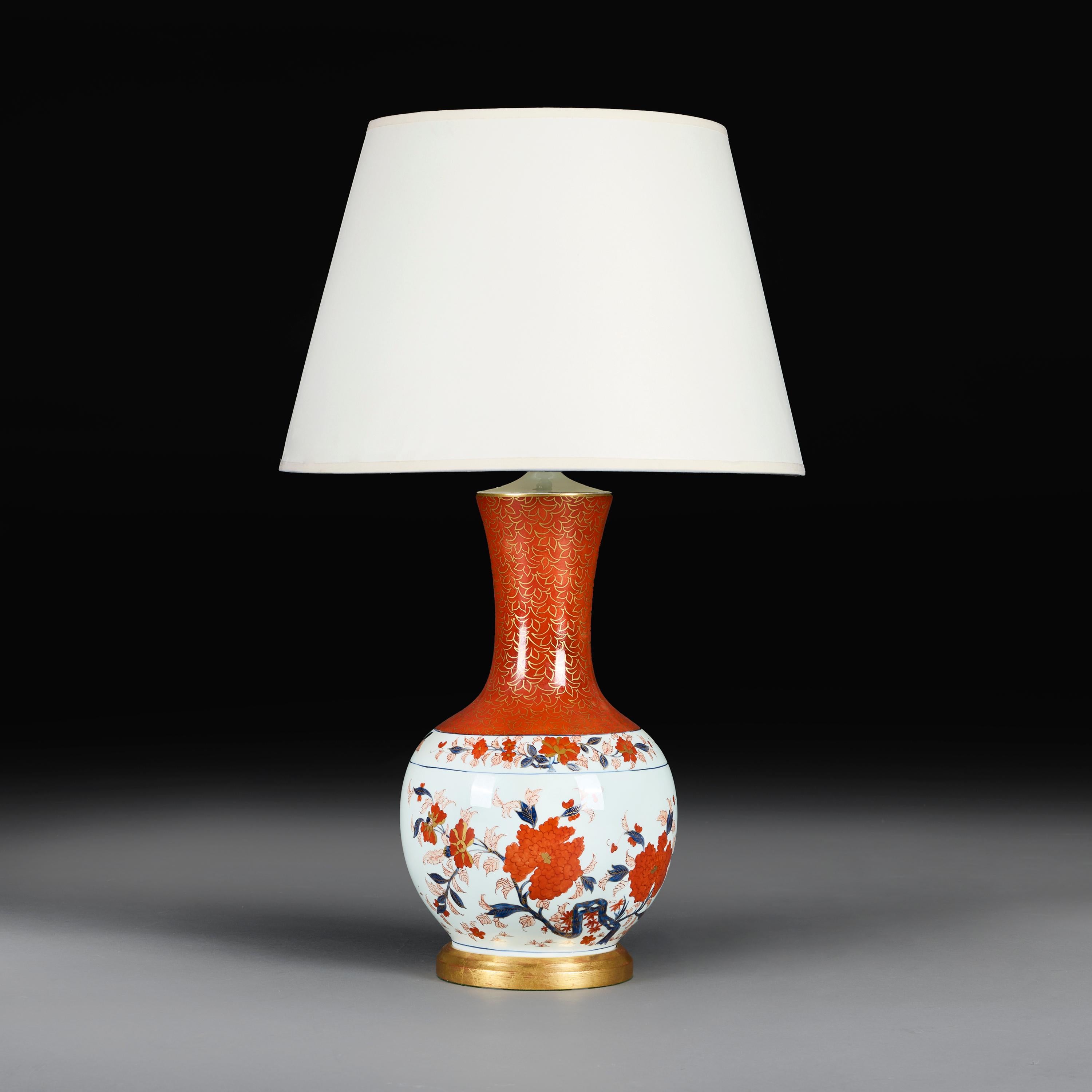 Japan, circa 1900

A late nineteenth century Japanese porcelain Imari vase, the spherical body decorated with flowering branches and the neck with gilt foliate patterns on a red ground, now mounted as a lamp on a giltwood base.

Height