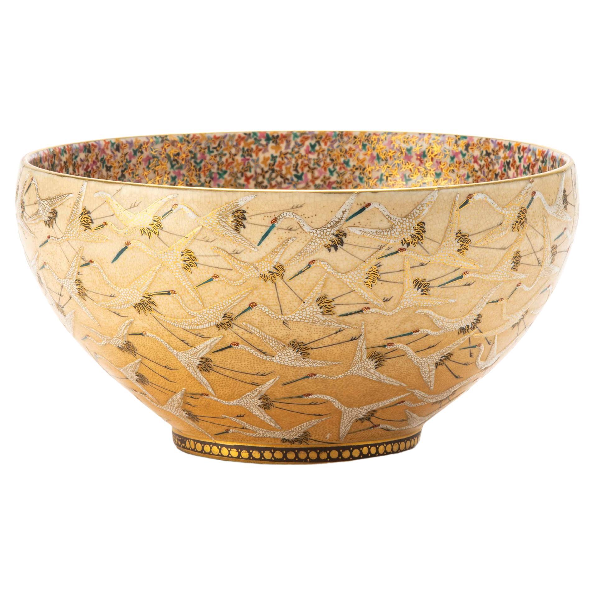 A Japanese Satsuma ceramic bowl adorned with relief glazes and gold details For Sale