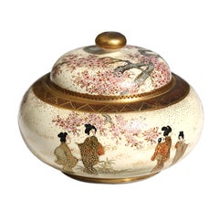 A Japanese Satsuma earthenware circular box and cover