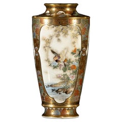 A Japanese Satsuma vase characterized by three oval reserves, signed by Ryozan