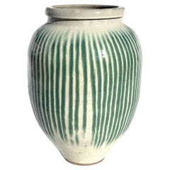 A Japanese Shigaraki Stoneware Sake Storage Jar, circa 1870.