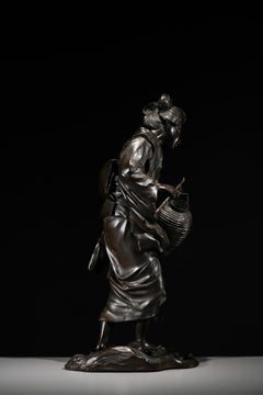 A Japanese Tokyo School Bronze Okimono Depicting a Walking Geisha