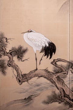 A Japanese two-panel screen with Manchurian cranes and pine trees