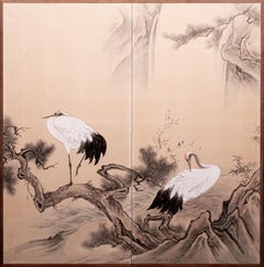 A Japanese two-panel screen with Manchurian cranes and pine trees