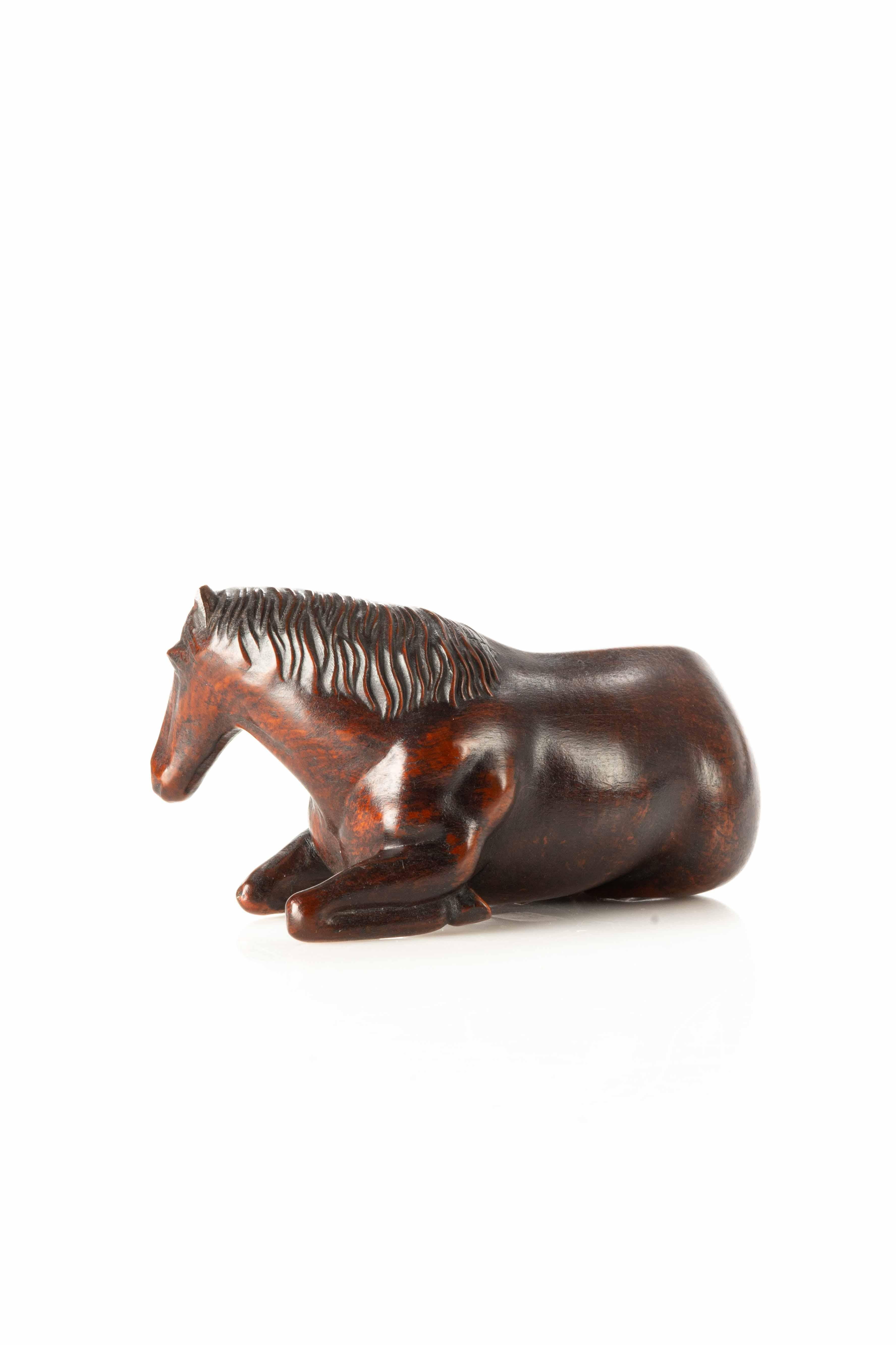 Japonisme A Japanese wooden okimono depicting a lying horse For Sale