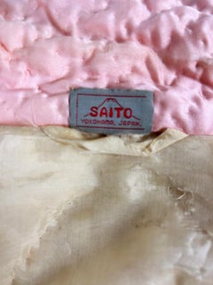 A Japonese Quilted and embroidered dressing gown in pink silk satin Circa 1940
