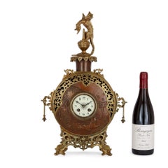 A Japonisme Gilt-Bronze and Brass Three-Piece Clock Set