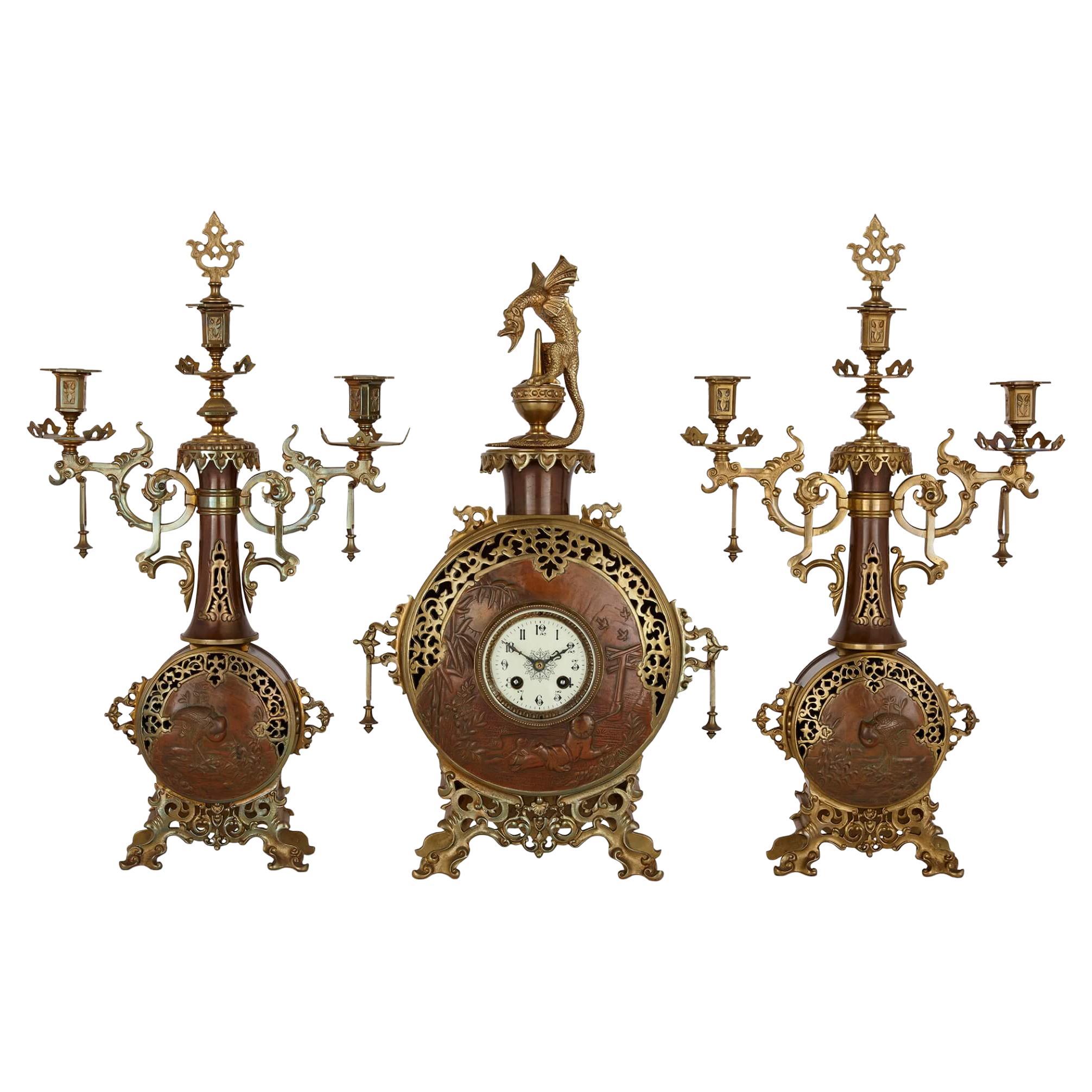 Japonisme Gilt-Bronze and Brass Three-Piece Clock Set