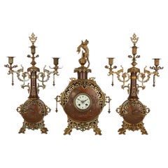 Japonisme Gilt-Bronze and Brass Three-Piece Clock Set