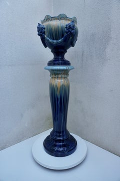 A Jardiniere on Column with Lion Head Decor in Flemish Earthenware Style