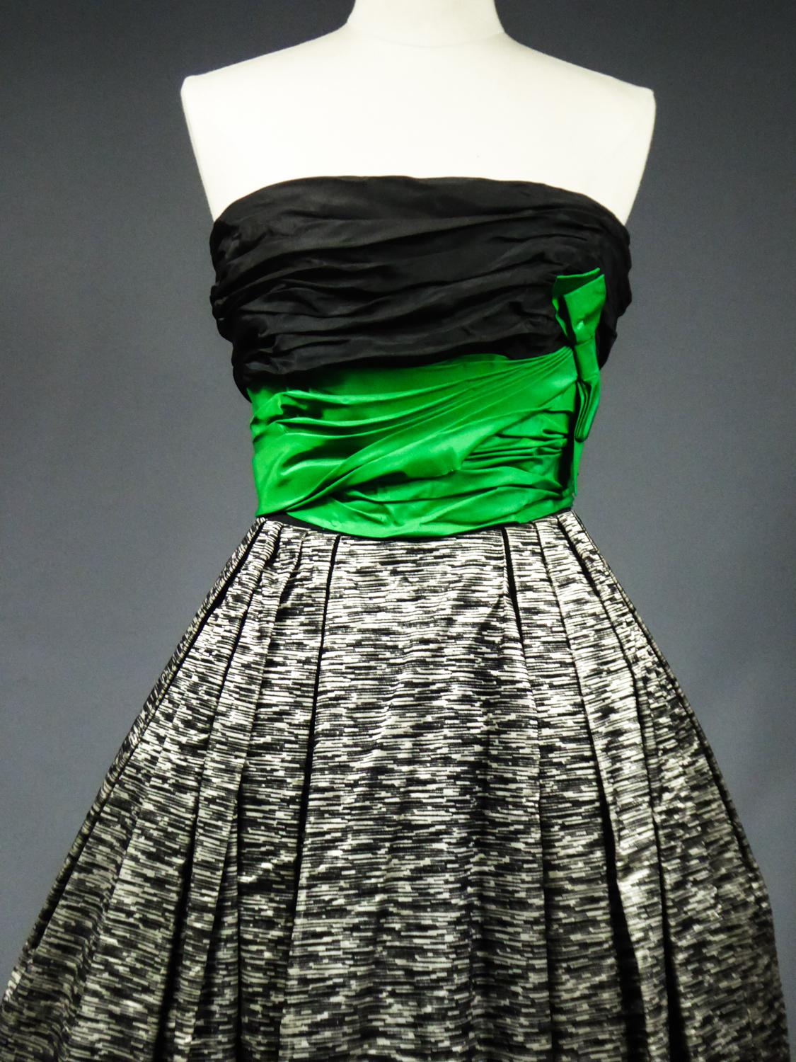 Circa 1955/1960
London England

Superb evening dress in taffeta and flocked velvet from the Jean Allen designer House in London from the late 1950s. The Pierre Balmain designer House in Paris supplied his models at Jean Allen designer House in