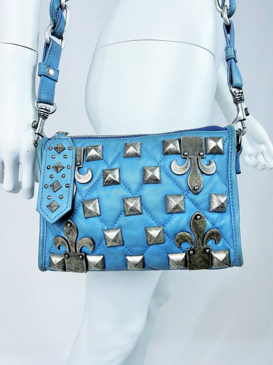 Circa 1995

France

Elegant little Vintage bag in turquoise blue stitched and studded leather by Jean-Charles de Castelbajac, dating from the 1990s. It has a conical shoulder bag shape in quilted leather with a steel zip fastening and is worn over