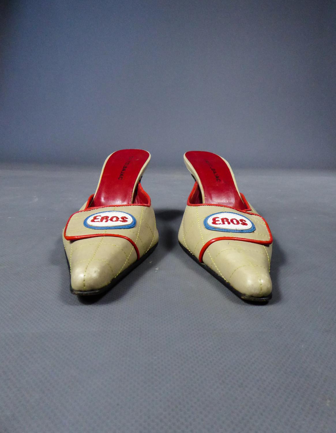 Circa 1990
France

Shoes or pair of mules in beige overstitched leather and signed Castelbajac from the 1990s. Long and pointed tips with flaps surrounded with red leather and adorned with an overstitched and embroidered label in leather indicating