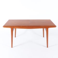 A Johannes Andersen mid century modern teak dining table circa 1960