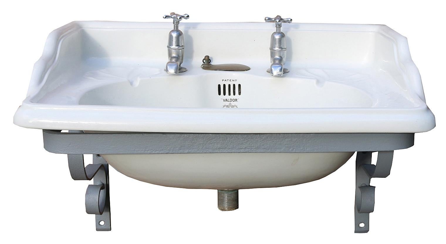 This basin is a ‘Valdor’ model by John Bolding and comes with an Iron wall mounting bracket. The taps are not original and have not been tested. The Iron Bracket has been sandblasted and finished in primer.