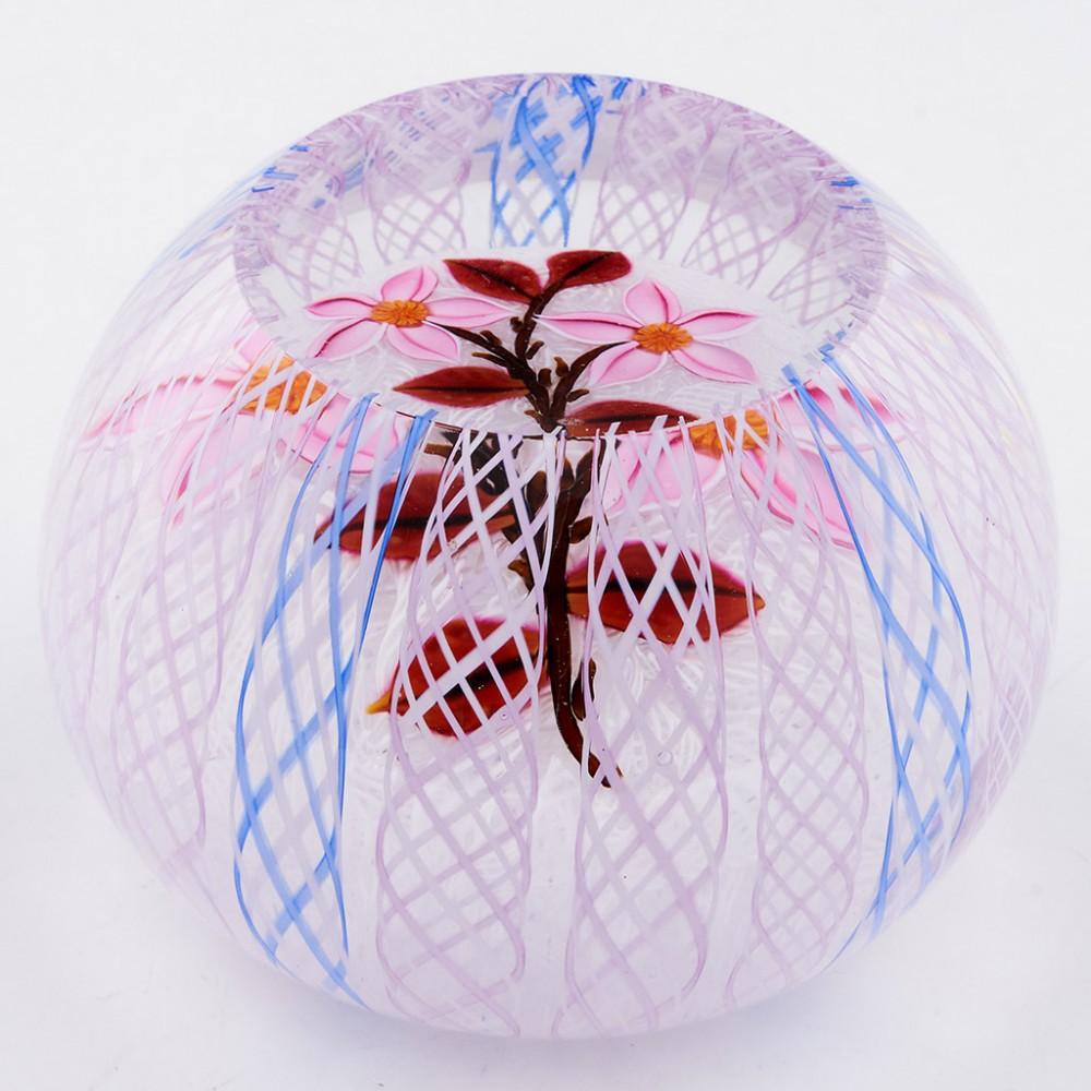 A John Deacons Lampwork Flowers with Latticino Overlay Paperweight, 2005

Additional information:
Date : 2005
Origin : Scotland
Features : Two pink lampwork flowers with millefiori canes on a muslin ground with outer latticino overlay
Marks : A JD