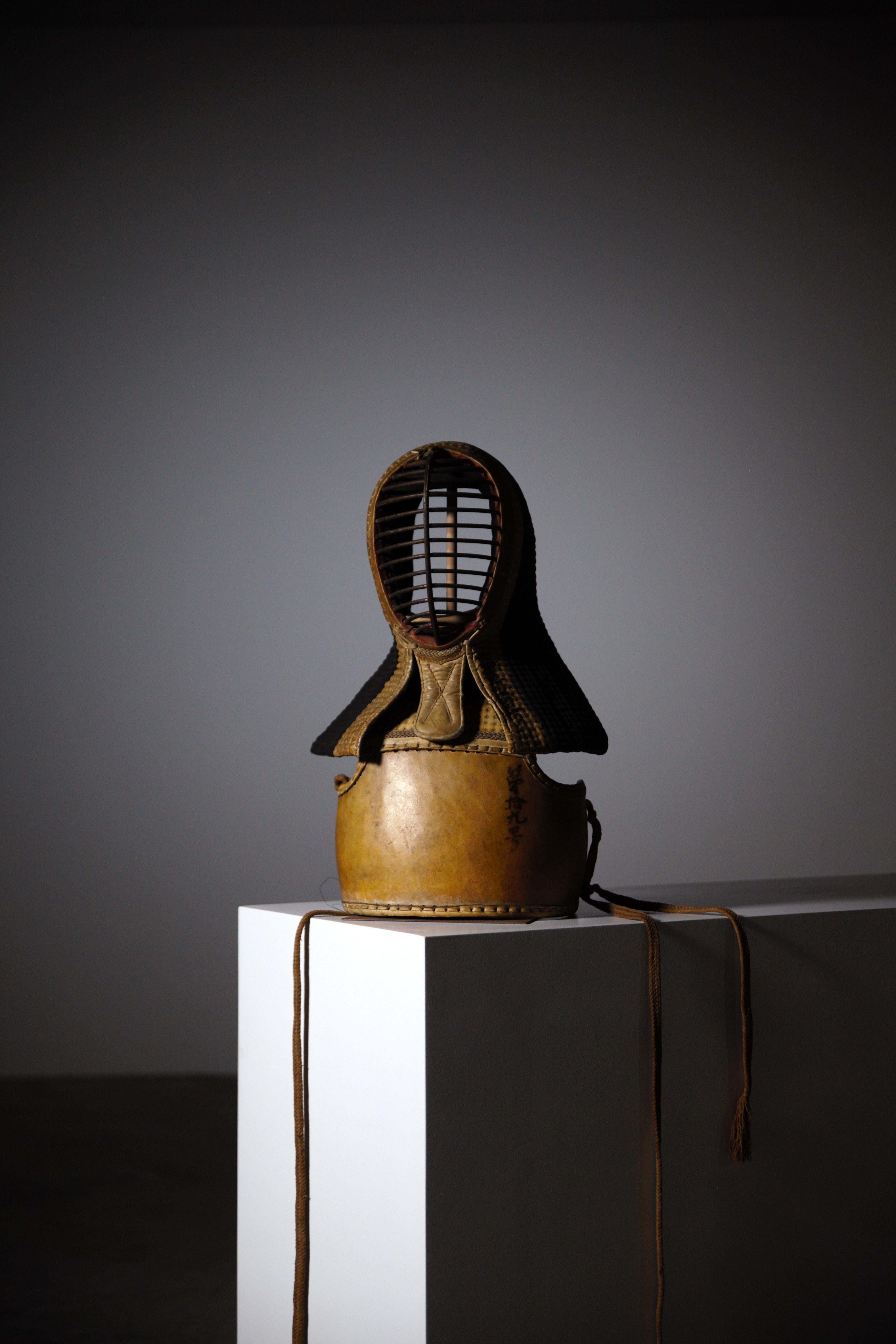 A Kendo mask and bust protection.

Japan 1930s.

Very good patina.

In original good condition