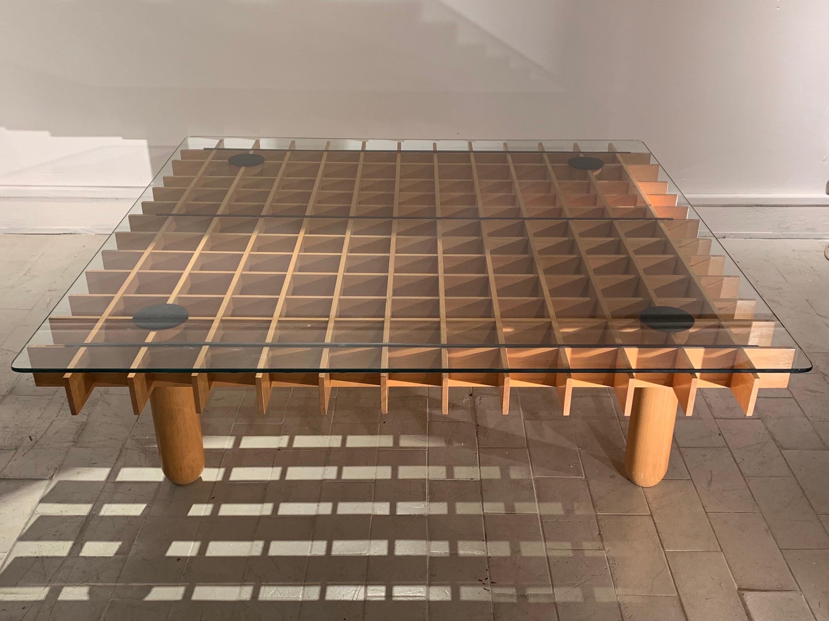 The table dates circa 1970s. This type of table is in the style of Gianfranco Frattini Kyoto table series. Common is the small square or rectangular model. This one is the large square one, which gives quite a presence as a coffee table, with a