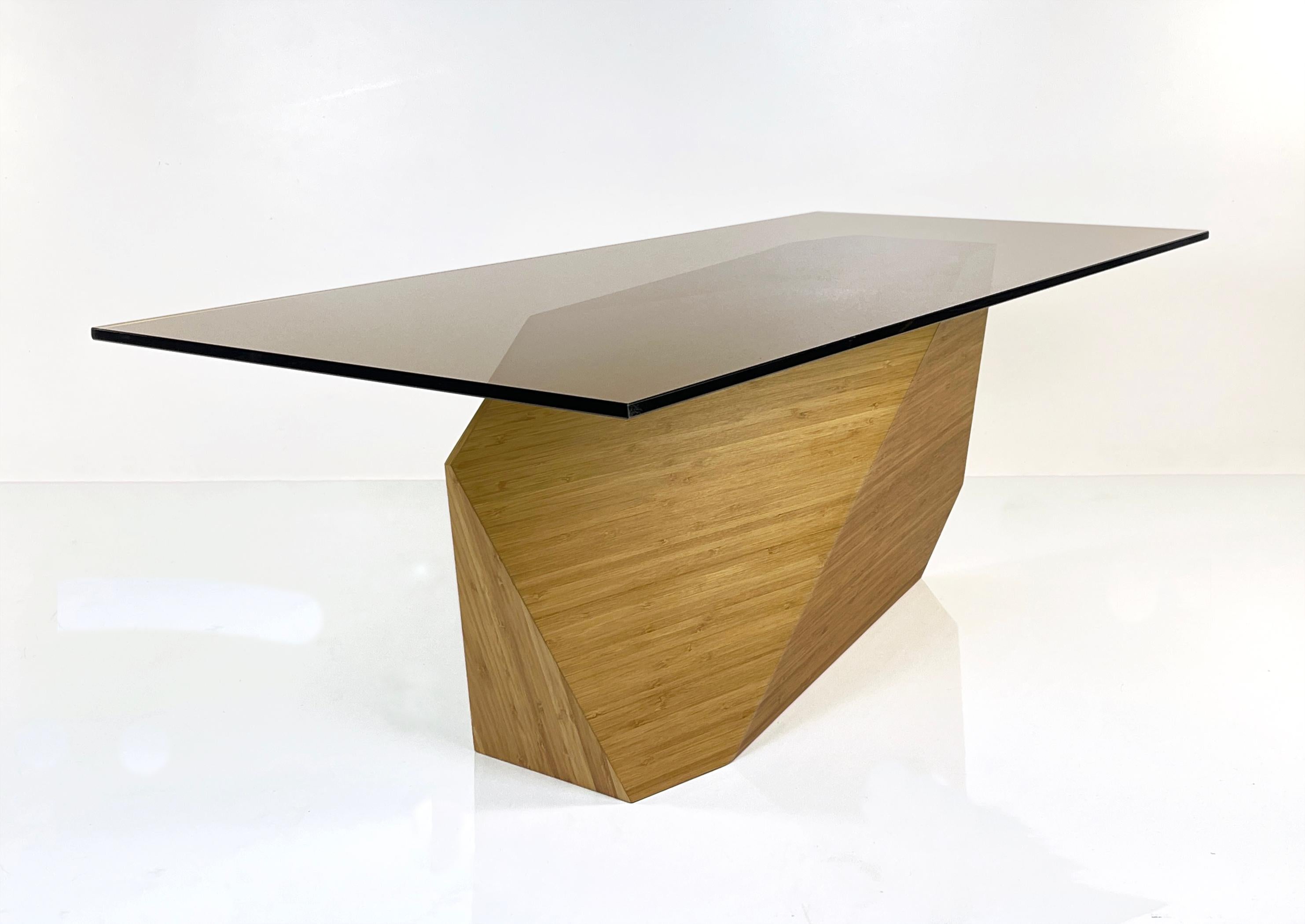 A client approached William needing a sculptural base for a 
dining table long enough to seat her very large family,
but narrow enough to set between her kitchen and living room.
The table top was to be less than 40