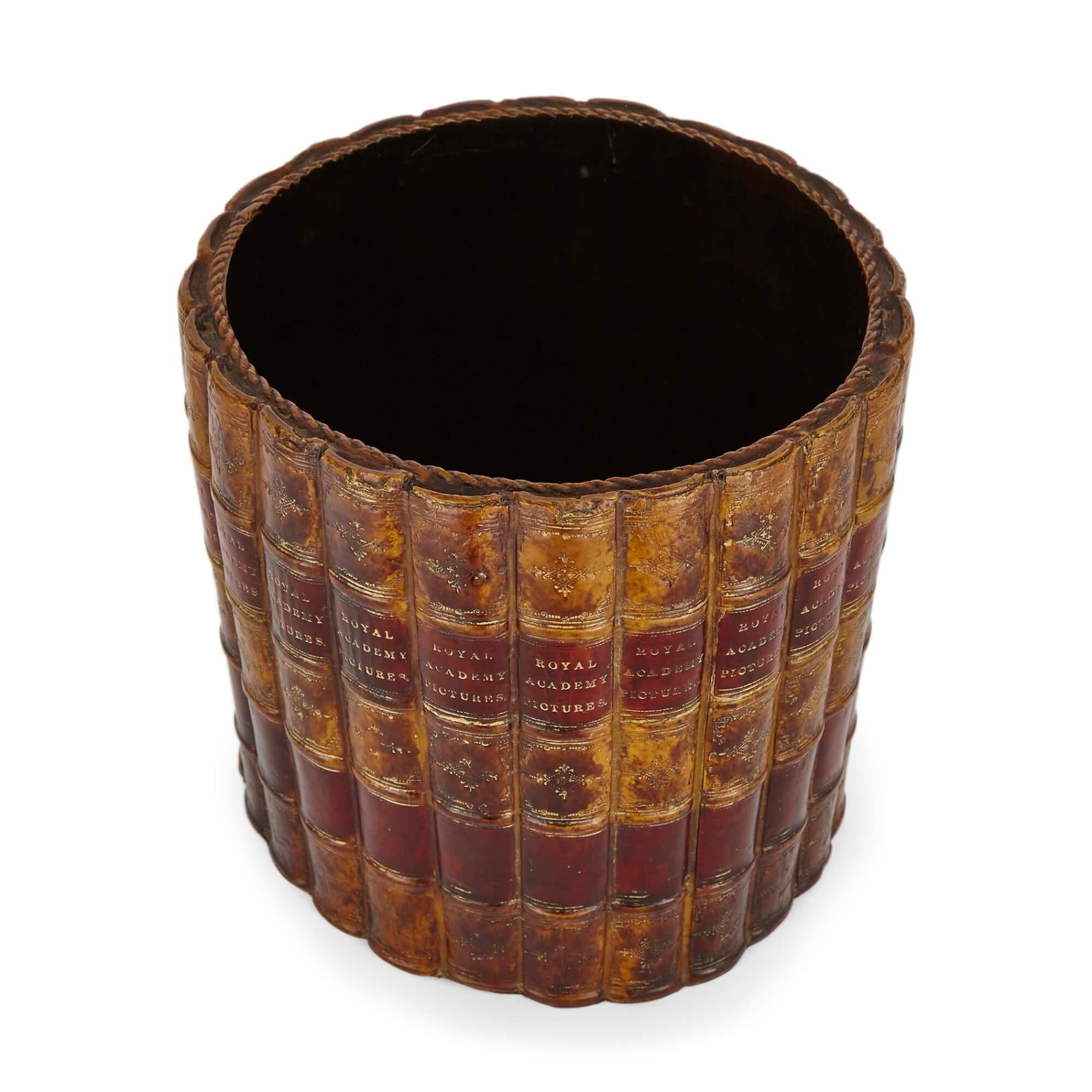 A lacquered Edwardian style novelty faux book spine waste paper basket
English, 20th century
Height 22cm, diameter 23cm

This quirky and curious piece is a English, early 20th century, Edwardian style lacquered waste paper basket made to give a