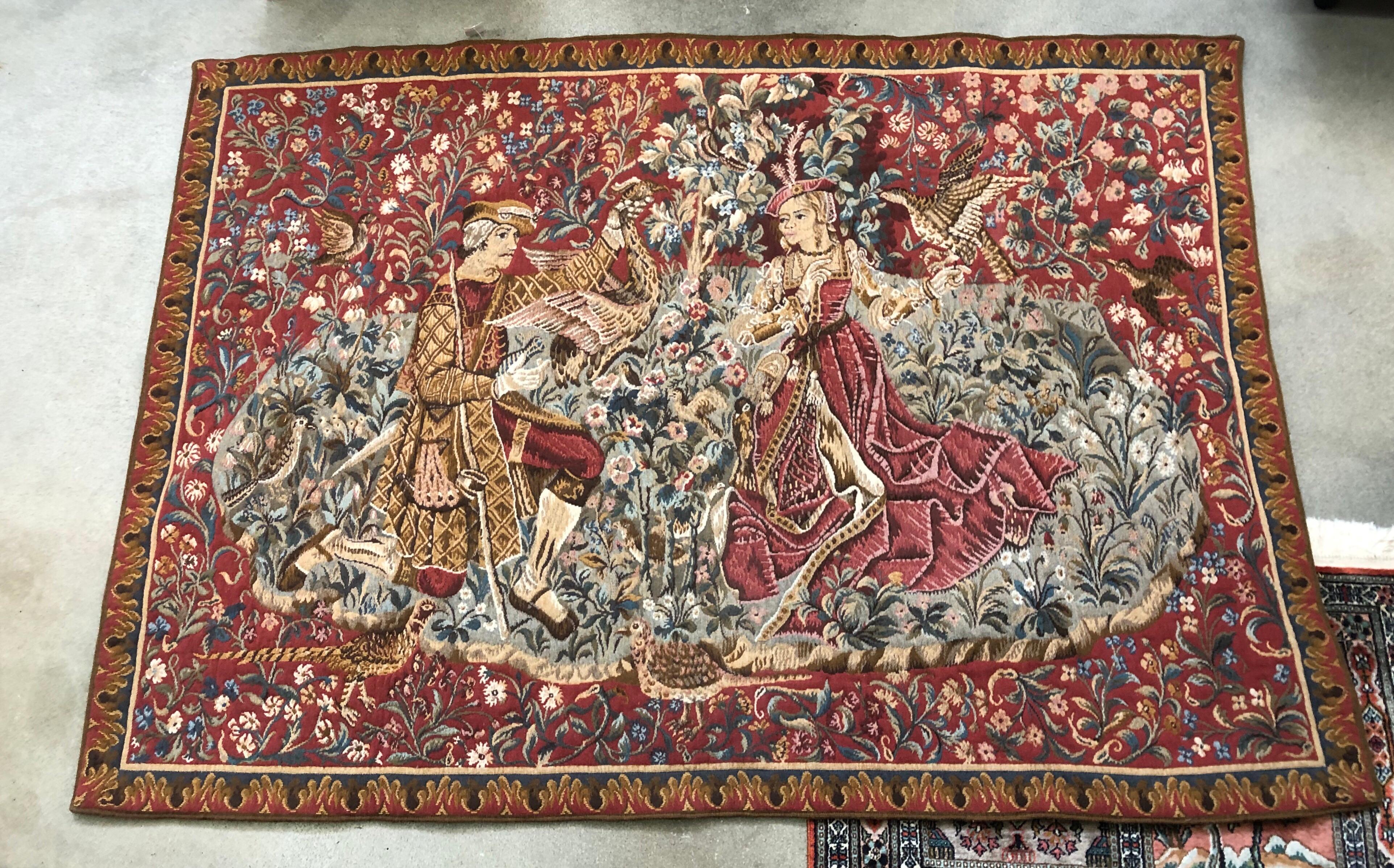 The original:
A lady and her falconer. Franco-Flemish tapestry, late 15th or early 16th century. Height 7 feet 8 inches. Lent by Mrs. David K. E. Bruce

The Noblest Of Sports: Falconry In The Middle Ages

 The lady in the tapestry carries a