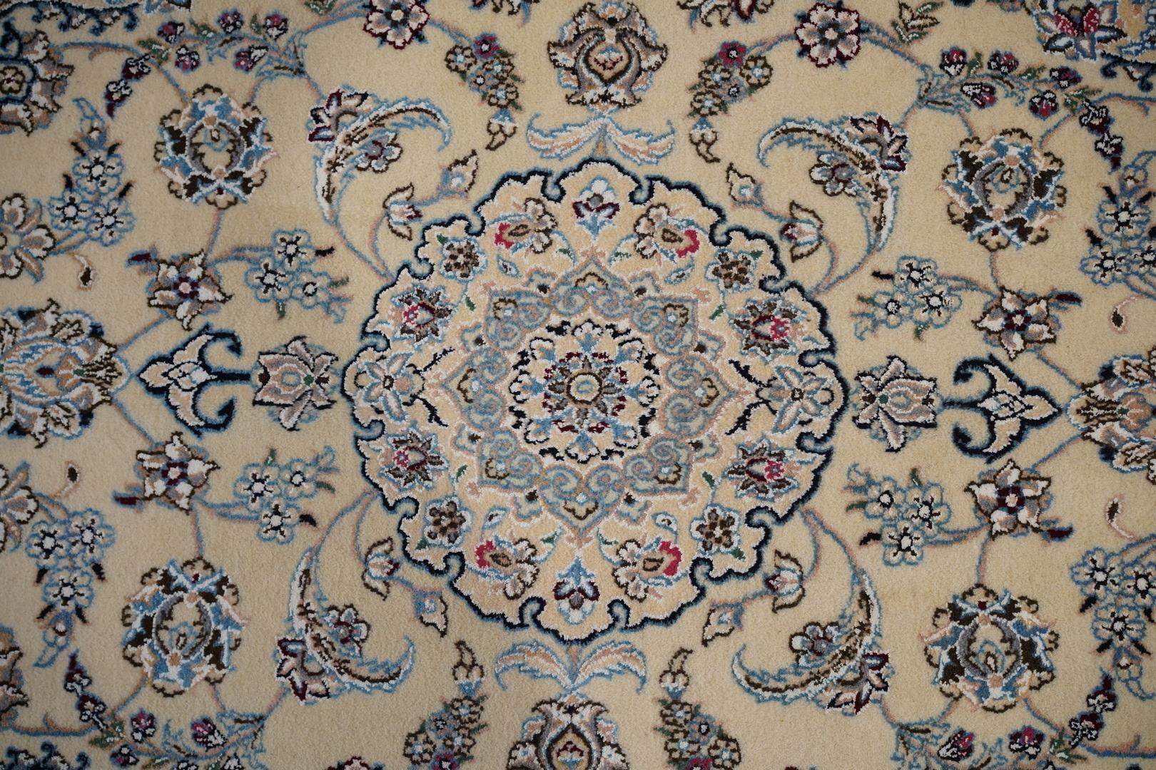 This soft and finely woven Esfahan was circa 1980 was found in a warehouse in as new condition . Soft lamb's wool in a light off white shade with several shades of pink and blues . Silk embroidery has been woven into the design as highlights -- see