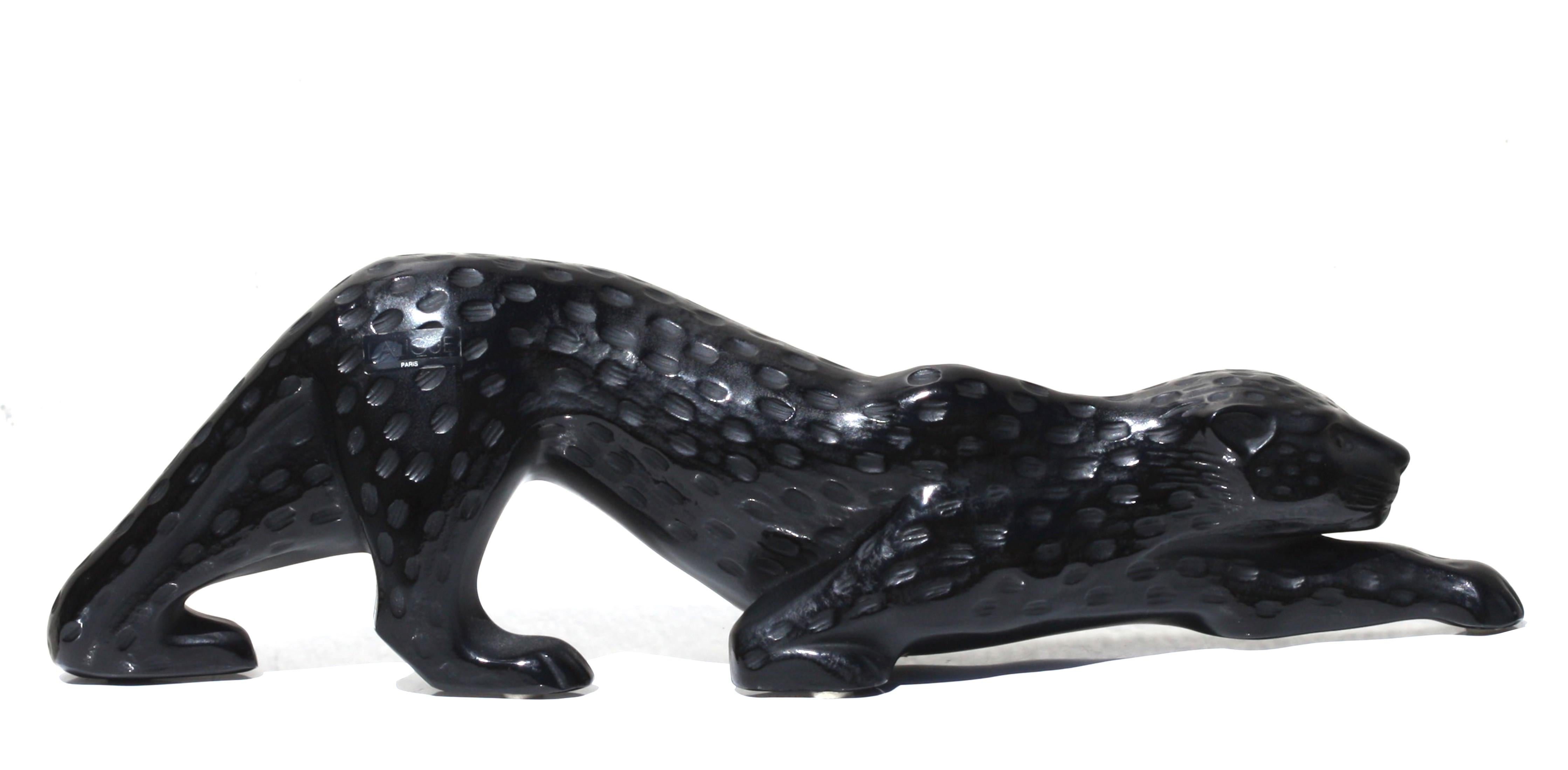 A Lalique black crystal figure of a panther, zeila
France, 20th Century
engraved Lalique France script marks, Lalique France
Length 14.5 in. (36.83 cm.).
 