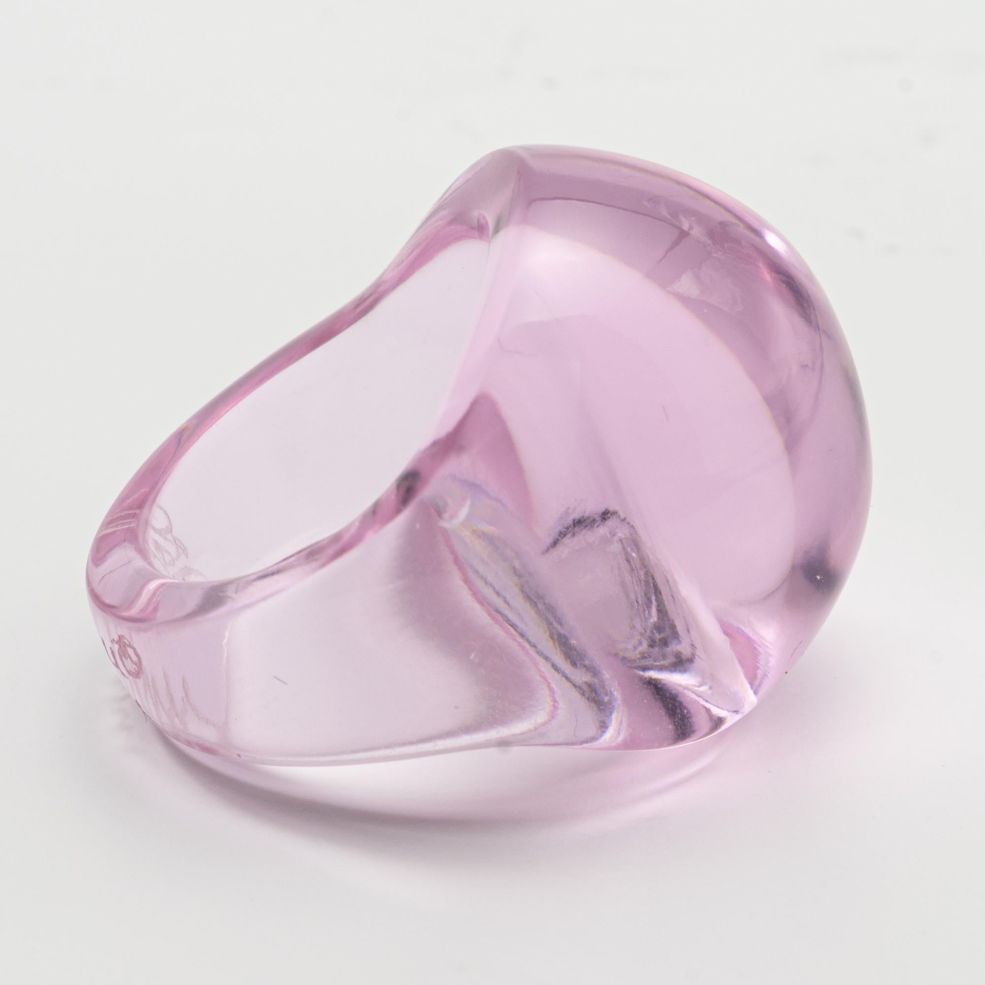 A Lalique Colored Glass Ring
Of bombé form, the pink hue glass ring, signed Lalique, size 5 1/2, circa 1980

