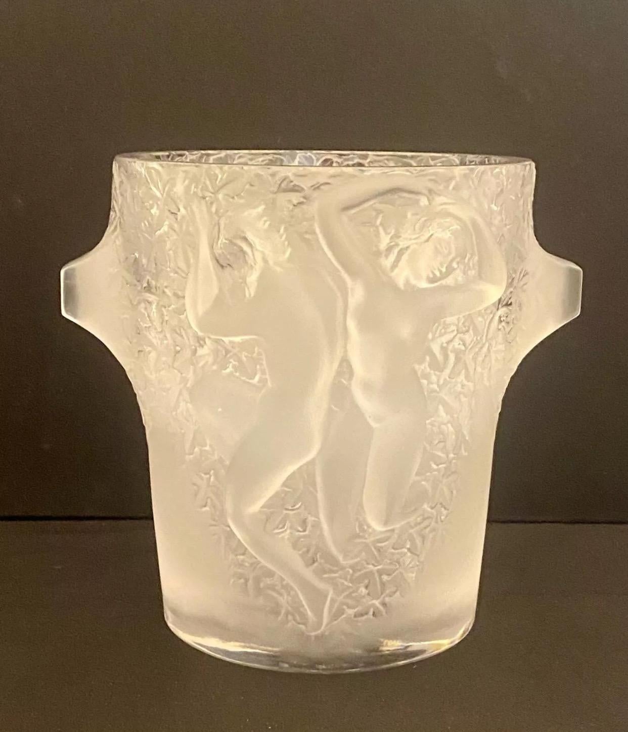  This French crystal champagne cooler/ice bucket was designed in the mid-1950s by Marc Lalique. The design is titled Ganymede after the mythological youth kidnapped by Zeus who eventually went on to serve as his cupbearer. The exterior of the ice