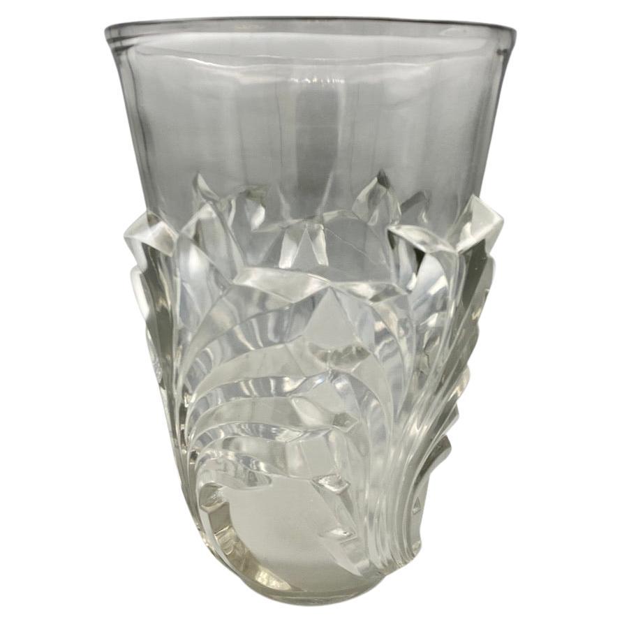 A strong designed glass vase by Marc Lalique dating back to the 1950tys.

The lalique company had then started its artistic change turning its back to the old glass production and introducing cristal in the post war productions as the fashion was