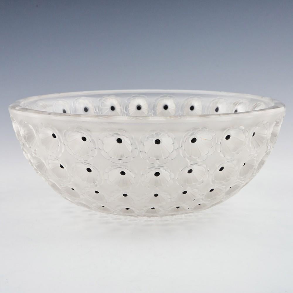 A Lalique Nemours Bowl designed in 1929 in Wingen sur Moder, France
The bowl features Frosted with sepia staining inside the cactus eyes and dark brown enamelling within. Incised LALIQUE FRANCE in the centre. This is a post war example.

René