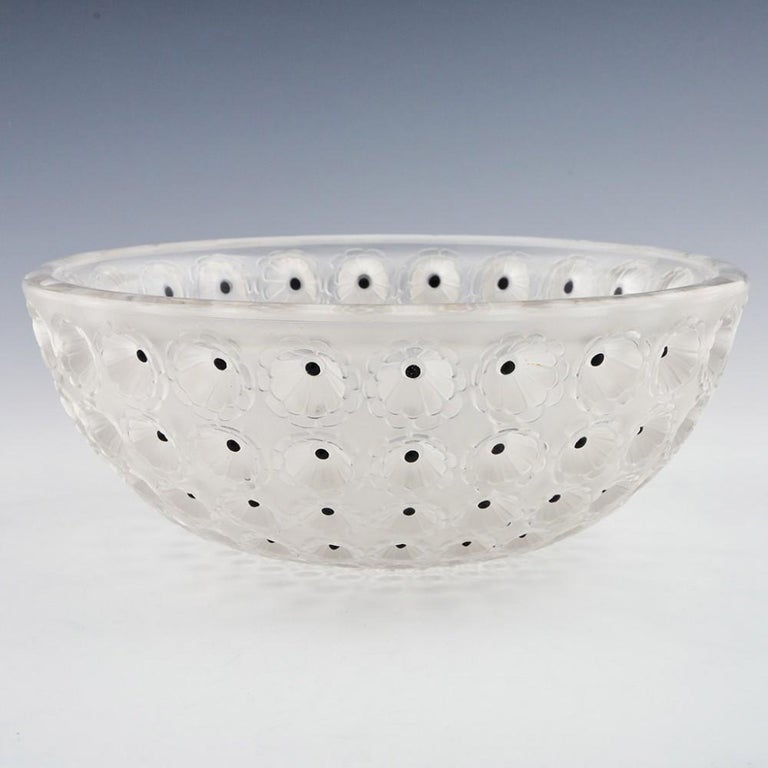 A Lalique Nemours Bowl designed in 1929 in Wingen sur Moder, France
The bowl features Frosted with sepia staining inside the cactus eyes and dark brown enamelling within. Incised LALIQUE FRANCE in the centre. This is a post war example.

René